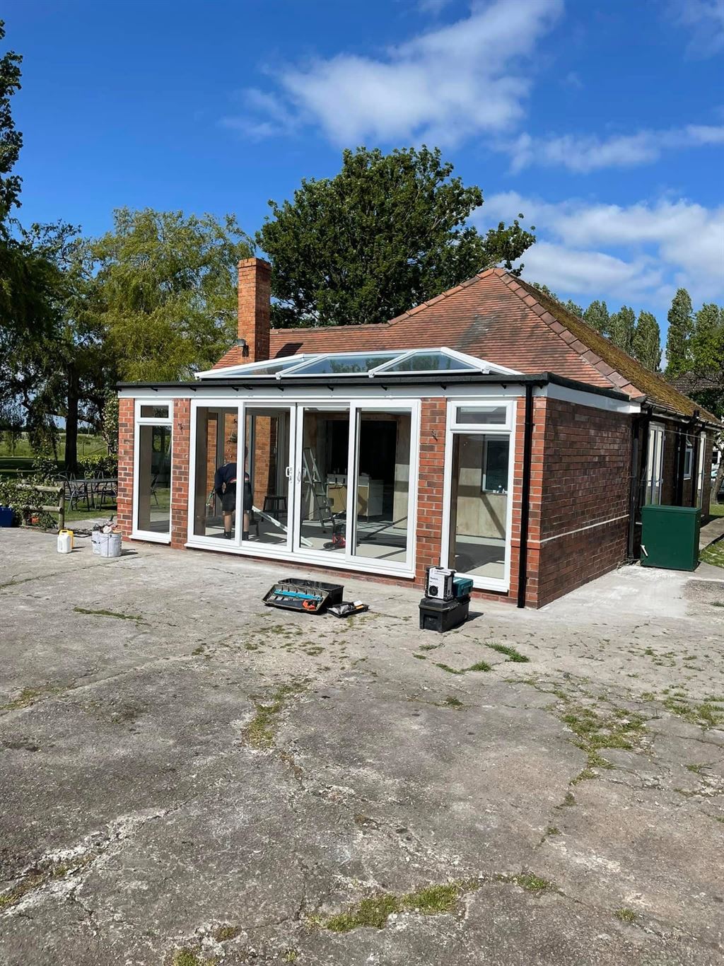 White orangery with roof lantern on a rural property